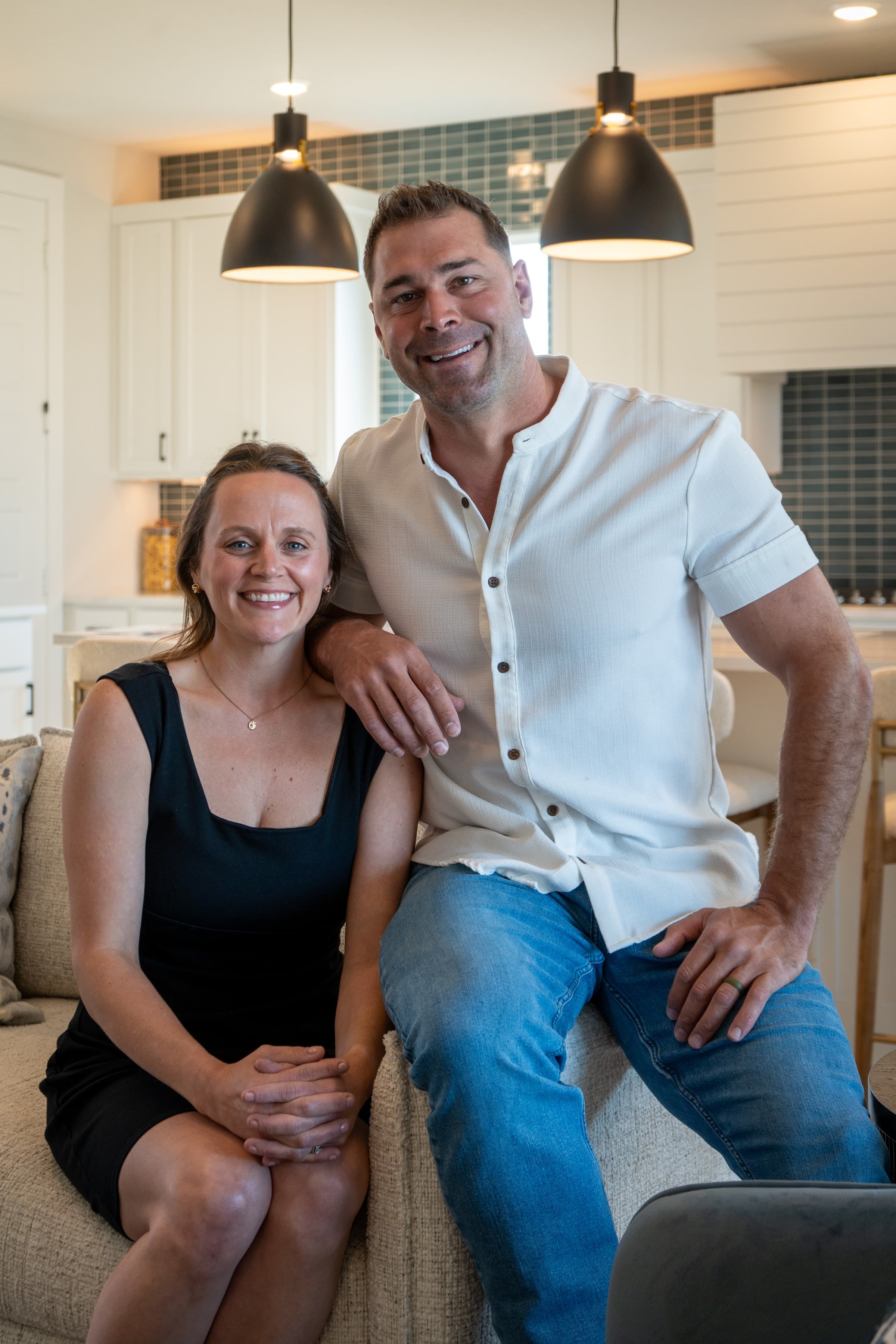 Mike and Natalie Evans sitting together in a living room